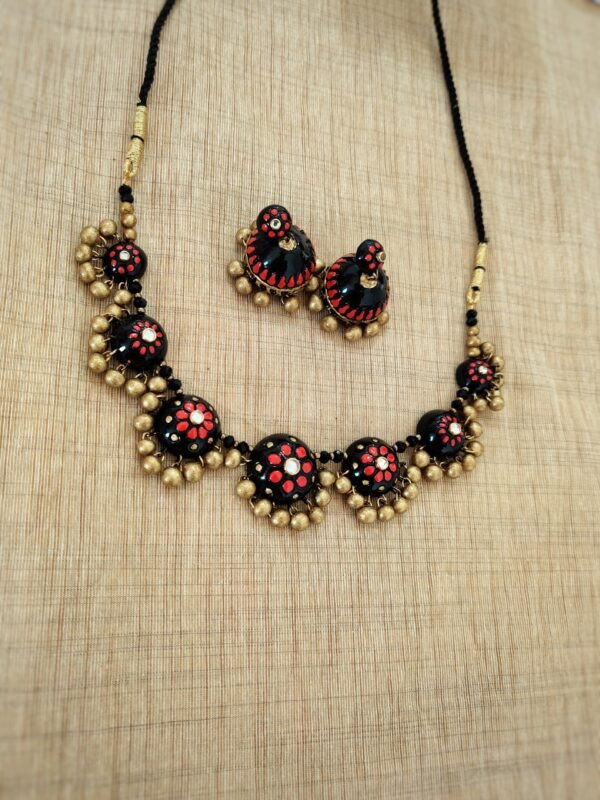 PARVANA-Terracotta-Short Necklace with Medium Size Jhumka ( Golden with Black & Red )
