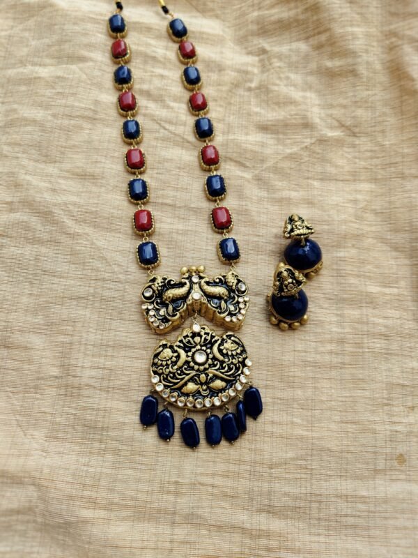 Devika- Terracotta Long Necklace with Medium size jhumka ( Golden with Blue and Red )